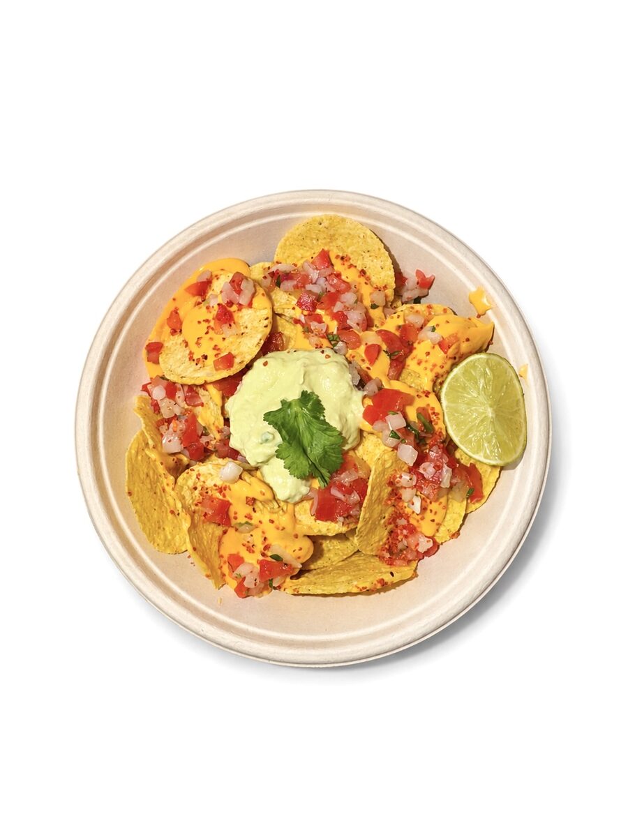 Nachoz bowl with tortilla chips, cheese sauce, pico de gallo and guacamole